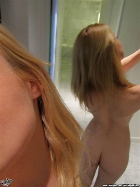 self shots of big boobed sexy assed blonde model kayden kross posing in the bathroom