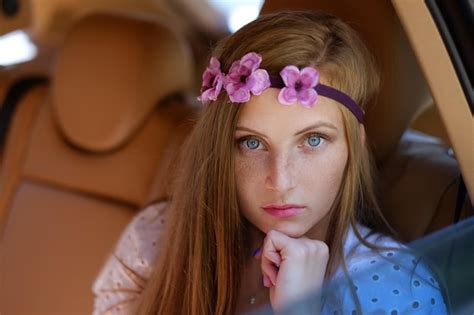 Premium Photo Portrait Of Freckled Female In A Car On Back Seat