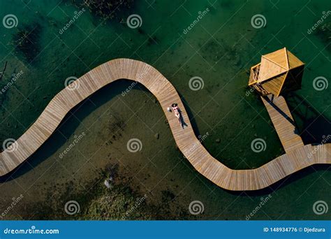 aerial drone view woman  swimsuit sunbathing   pier stock photo image  relax