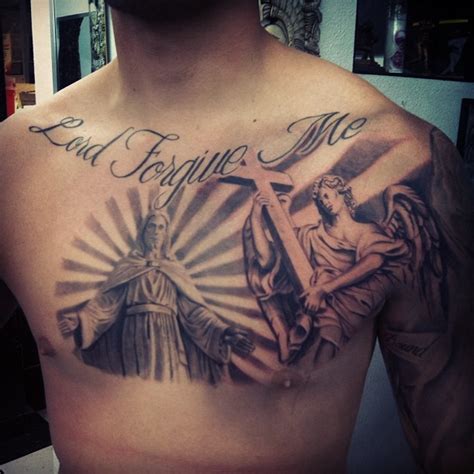 Jesus And The Angel With A Cross Tattoo On Chest Tattooimages Biz