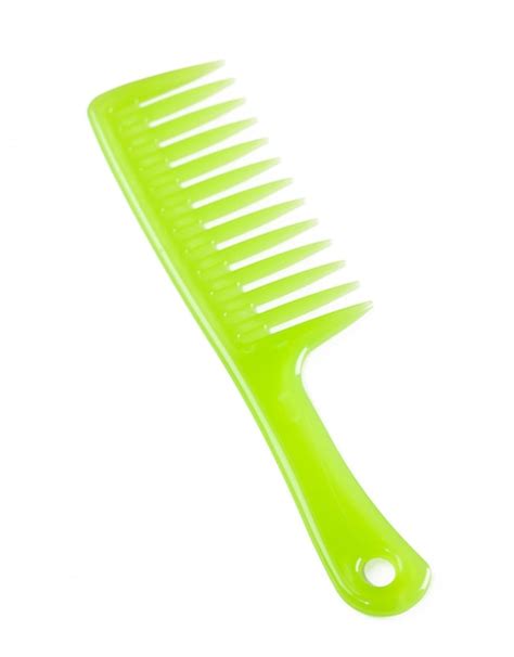 premium photo green plastic comb