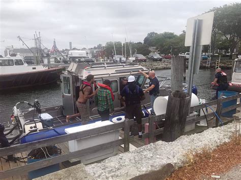 three men rescued after boat sinks near mt hope bridge
