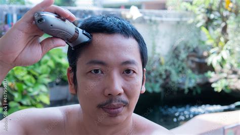 Black Haired Asian Men Cut Or Shave Their Own Hair Manually Cut A