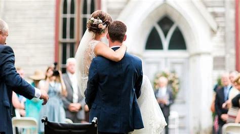 romantic groom carries bride down the aisle after car crash leaves her