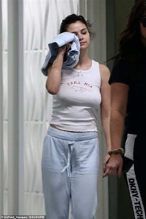 Selena Gomez Goes Braless In White Tank Top And Sweatpants As She