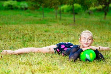 flexible little blondie girl doing gymnastics horizontal