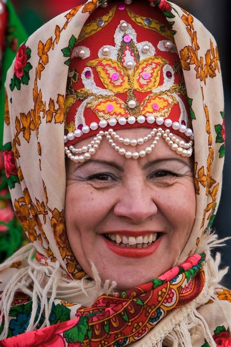 A Russian Woman In Traditional Costume Waits For The