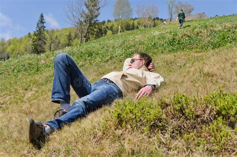 man lying   steep hillside stock image image  environment lazy