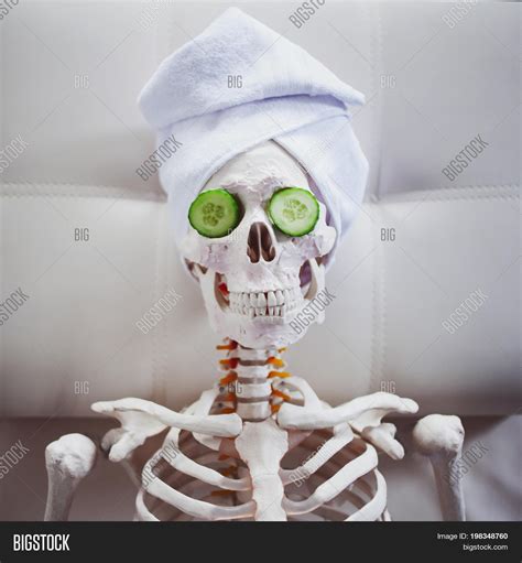 Skeleton In Spa Salon With Towel On Her Head And Mask On