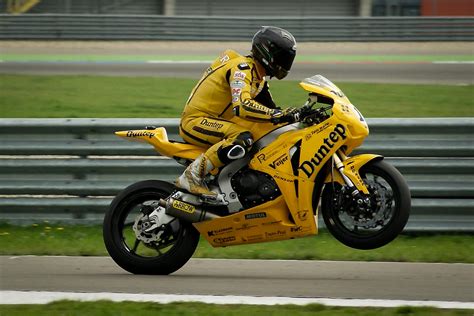 person riding  yellow sports bike  stock photo