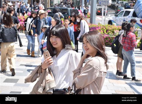 Two Beautiful Japanese Girls On The Streets Of Omotesando District In