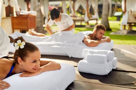 couple treatment spa people enjoying relax massage outdoors stock