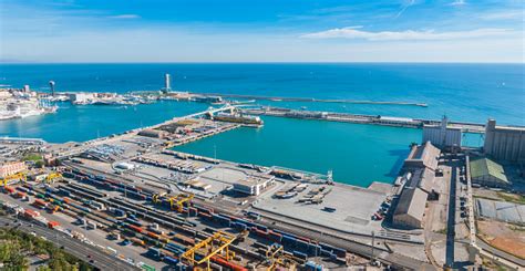 sunshine  balearic sea barcelona industrial shipping  rail ports   bluesky day stock