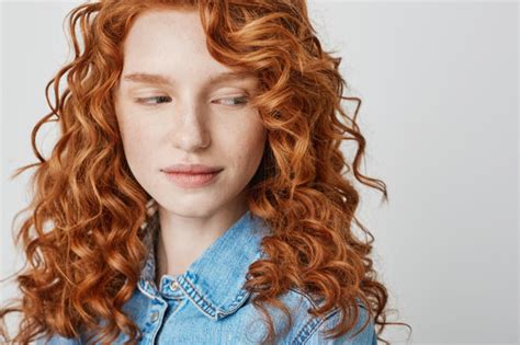 Close Up Of Pretty Redhead Girl With Freckles Copy Space