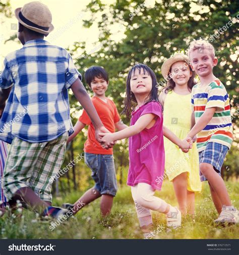 children friends playing playful active concept stock photo