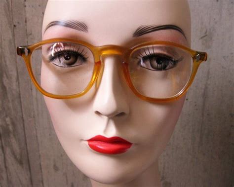 these yellow horn rim glasses date to the 1950s and were made by