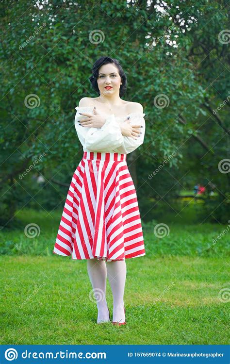 Vintage Portrait Of A Woman In Retro White And Red Dress