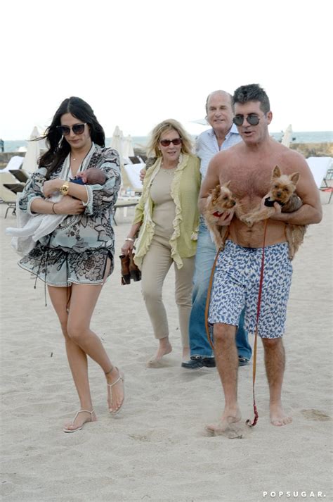 simon cowell and lauren silverman on the beach after birth popsugar