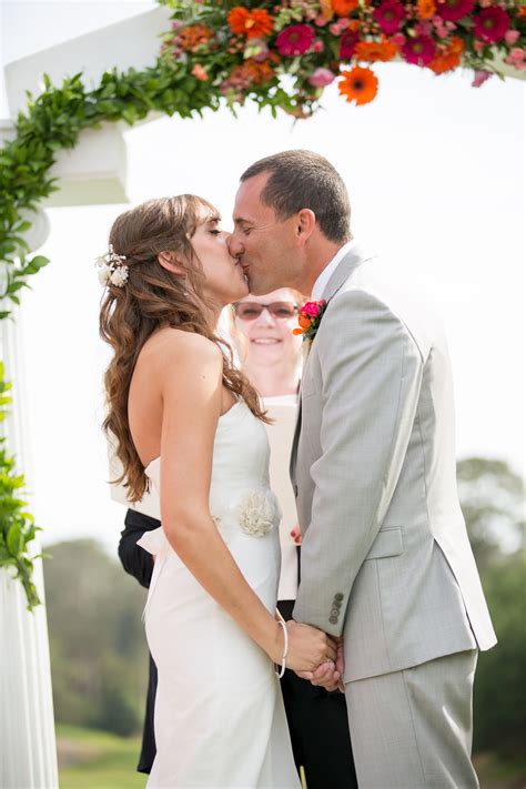 outdoor ceremony bride and groom first kiss