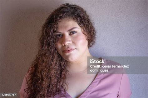 Chubby Mexican Woman With Latin Appearance With Curly Hair Lying On Her
