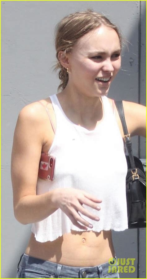 lily rose depp shows off her toned tummy in crop tank top photo