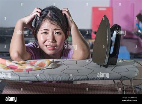Portrait Of Young Pretty Frustrated And Stressed Asian Chinese Woman