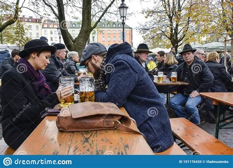 tourists  locals visit traditional beer garden biergarten  munich