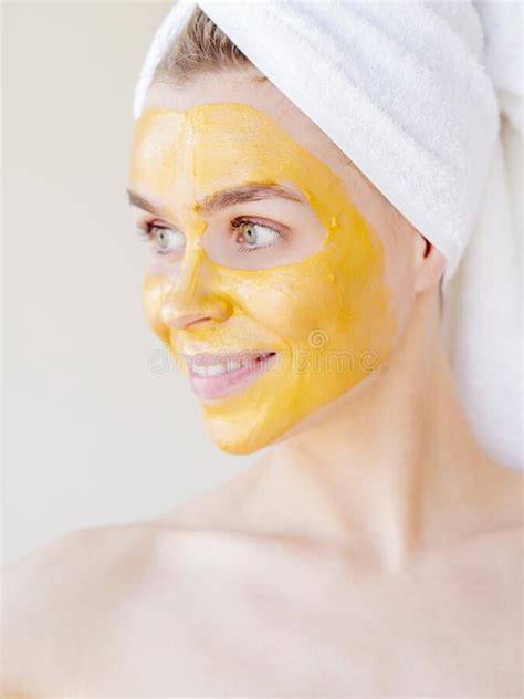 Homemade Beauty Treatments Joyful Woman With A Yellow Natural Facial