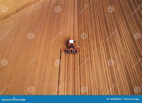 drone photography  tractor  seeder working  field stock photo image  field