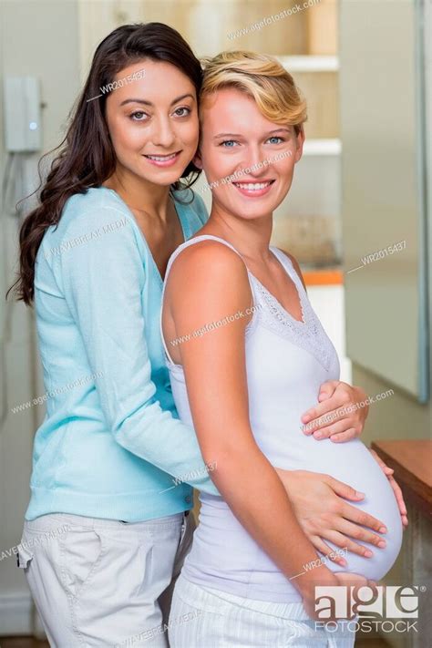 Lesbian Girl Touching Her Pregnant Girlfriends Stomach Foto De Stock