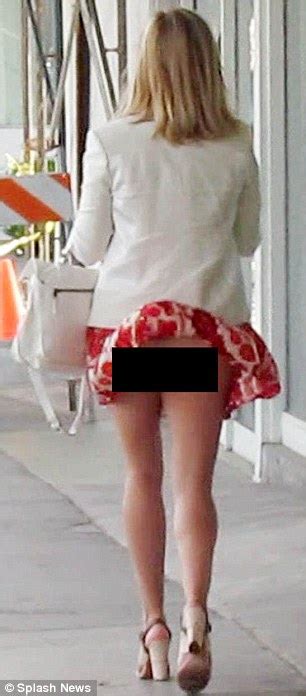 Reese Witherspoon Suffers A Wardrobe Malfunction As The Wind Whips Up