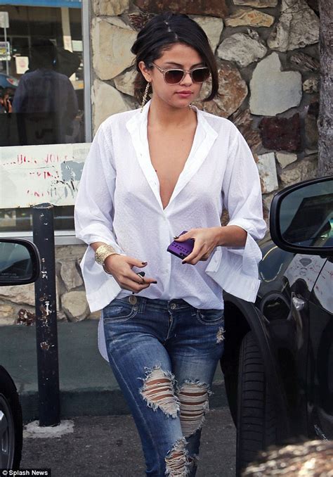 selena gomez wears super low cut oversized blouse and ripped jeans for breakfast out with a