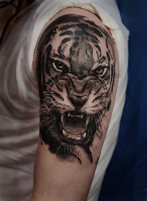 realistic tiger tattoo   left upper arm  shoulder tribal tiger tattoo mens tiger