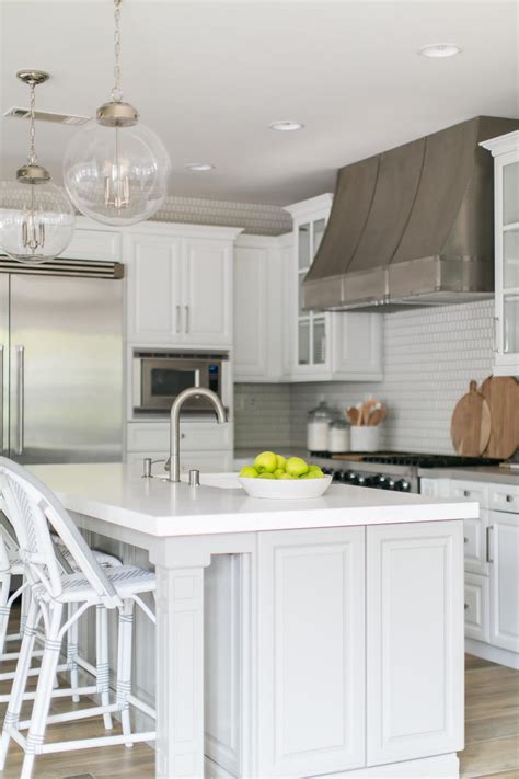 contemporary white kitchen  work island  modern appliances  lighting hgtv