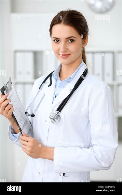 Latin American Doctor Woman Standing With Arms Crossed And Smiling At
