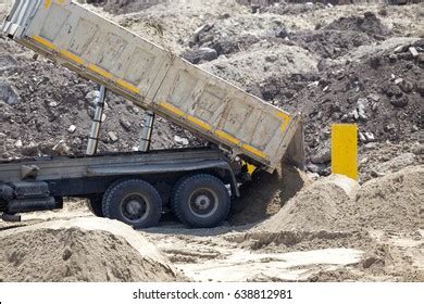 dumping truck tipping dirt construction site stock photo