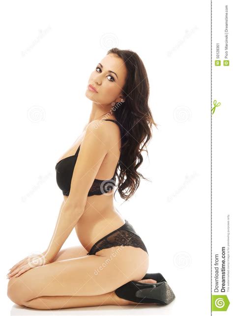 Side View Woman In Lingerie Sitting On Knees Stock Image