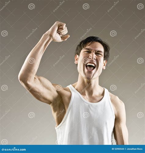 muscular man making fist  cheering stock photo image  motioning