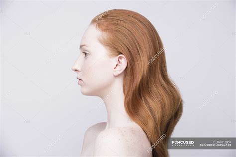 portrait  young woman side view bare shoulders feminine beauty