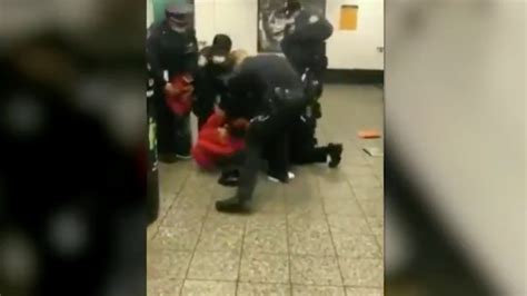 video shows nypd cops handcuffing woman on the ground in front of her