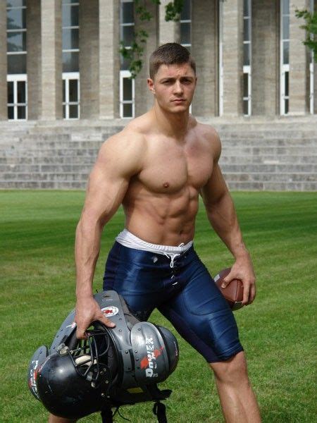 hot muscle football jock shirtless with 6 pack abs carrying gear hotathletes sports androgyn