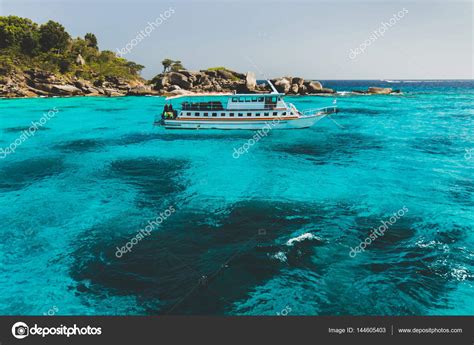 tourist boat  island shore stock photo  colegbreslavtsev