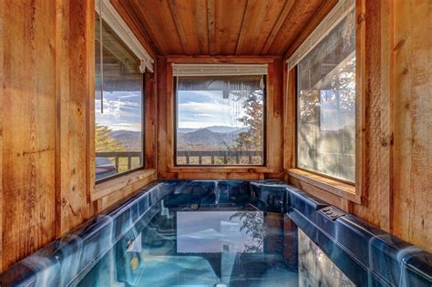 cozy log cabin w private hot tub fireplace and deck close to town