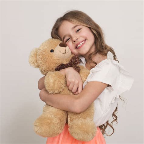 child holding stuffed animal stock  pictures royalty