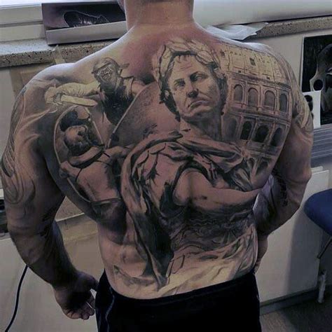 A Man With Tattoos On His Back Is Standing In The Kitchen
