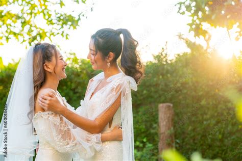 Zdjęcie Stock Beautiful Asian Woman Lesbian Couple In Wedding Dress