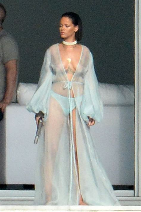 topless rihanna poses with gun wearing just a thong as she