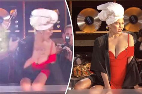 Chrissy Teigen’s Boobs Almost Burst Out Of Dress On Lip Sync Battle