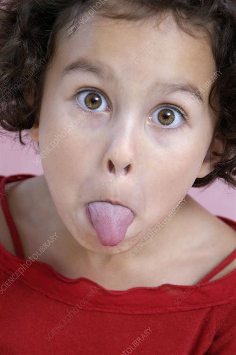 girl sticking out her tongue stock image p701 0480 science photo