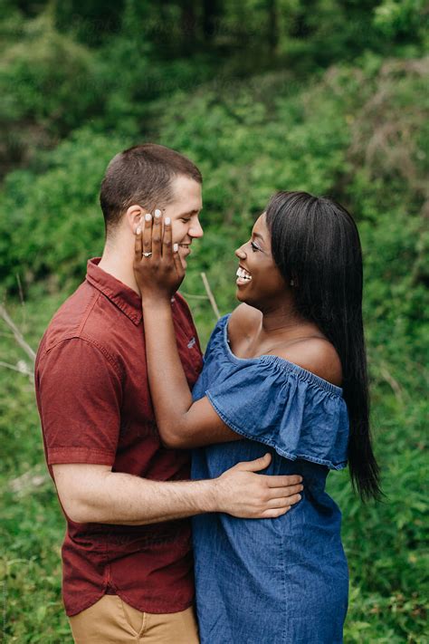 portrait of happy interracial couple by leah flores